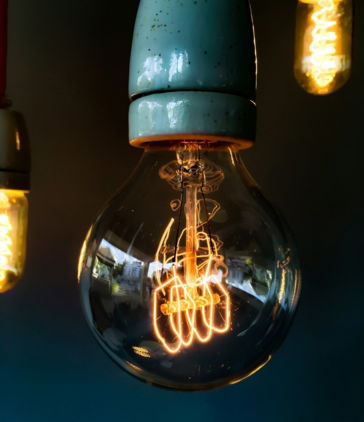 turned-on-clear-glass-light-bulb.jpg turned on clear glass light bulb