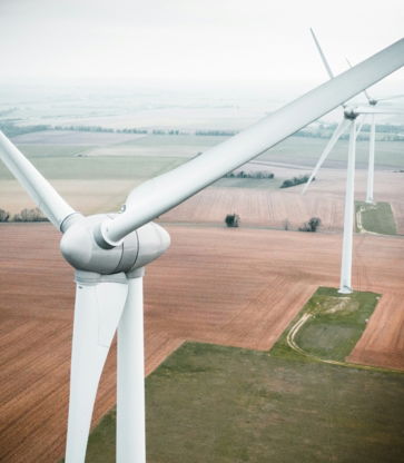 three-white-windmill-during-daytime.jpg three white windmill during daytime