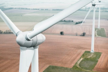 three-white-windmill-during-daytime.jpg three white windmill during daytime