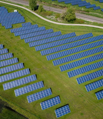 aerial-photography-of-grass-field-with-blue-solar-panels.jpg aerial photography of grass field with blue solar panels